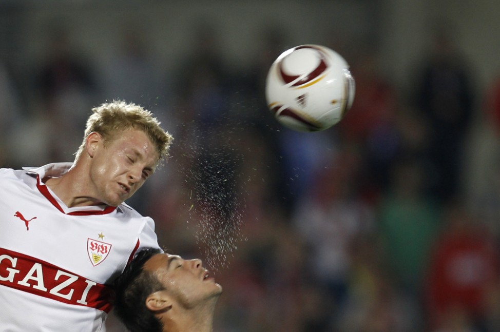 Getafe's Sardinero  fights to head the ball with VfB Stuttgart's Funk during their Europa League Group H soccer match at Colisseum Alfonso Perez stadium in Getafe