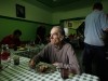 Henryk, who has lived at the Camillian Mission shelter for homeless people for five years, looks out as he eats his meal at the shelter in Warsaw