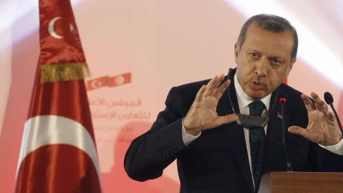 Turkish Prime Minister Recep Tayyip Erdogan  speaks during a news conference in Tunis