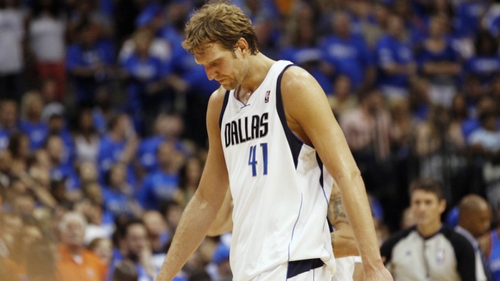 Dallas Mavericks' Nowitzki walks off the court during a timeout against the Oklahoma City Thunder during their NBA Western Conference quarter-final playoff basketball game in Dallas