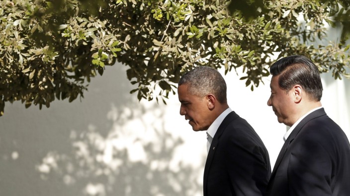 U.S. President Obama walks with Chinese President Xi at The Annenberg Retreat in Rancho Mirage