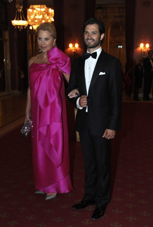 Eva Maria O'Neill and Sweden's Prince Carl Philip arrive for a dinner at Grand Hotel in Stockholm