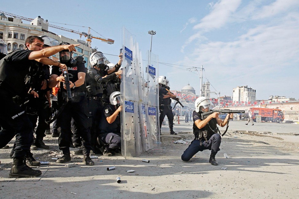 Turkish riot police fire teargas during a protest at Taksim Square in Istanbul