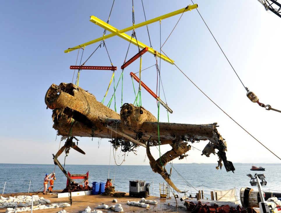 Royal Air Force Museum handout photo shows a World War Two-era German aircraft being raised by a salvage crew off the coast of Deal, southeast England