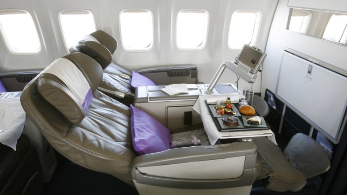 OpenSkies 'Biz' seat is pictured with refreshments and personal entertainment units on one of its Boeing 757-200 jets that features business class only cabins in Dulles Virginia