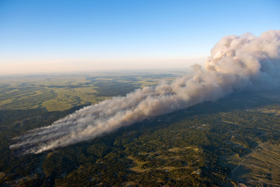 An aerial photo shows wildfire burning homes in Black Forest community near Colorado Springs