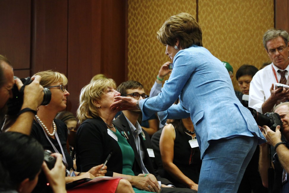 U.S. House Minority Leader Pelosi consoles a woman whose daughter was a slain Sandy Hook Elementary School teacher, during a news conference about gun violence legislation in Washington