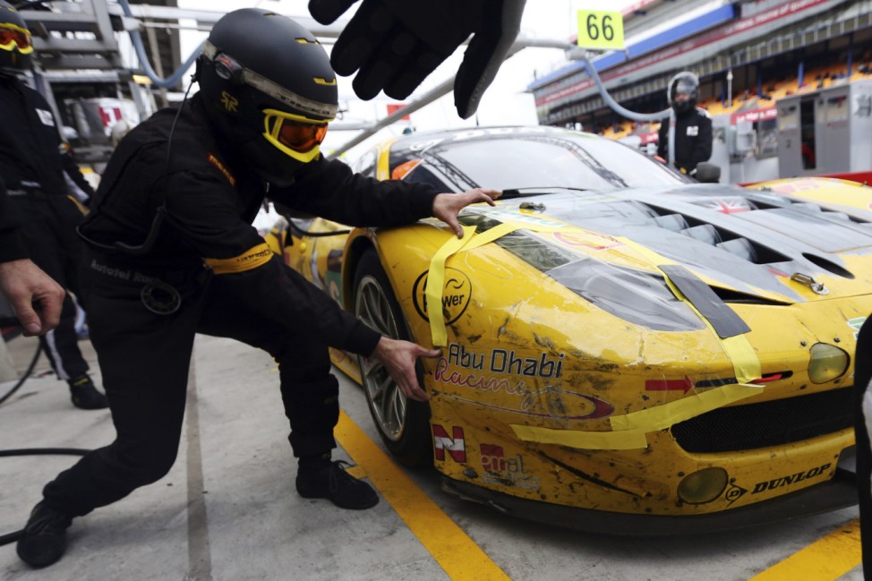 A mechanic works on the Ferrari 458 Number 66 driven by Turki Al Faisal of Saudi Arabia during the Le Mans 24-hour sportscar race in Le Mans