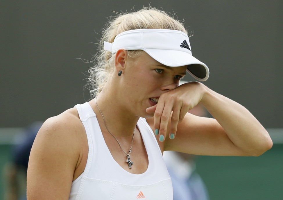 Caroline Wozniacki of Denmark reacts during her women's singles tennis match against Petra Cetkovska of the Czech Republic at the Wimbledon Tennis Championships, in London