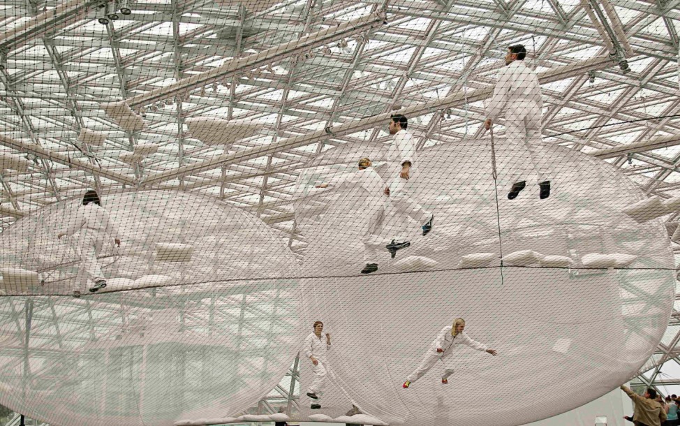 Visitors climb through installation 'in Orbit' by artist Saraceno in Duesseldorf