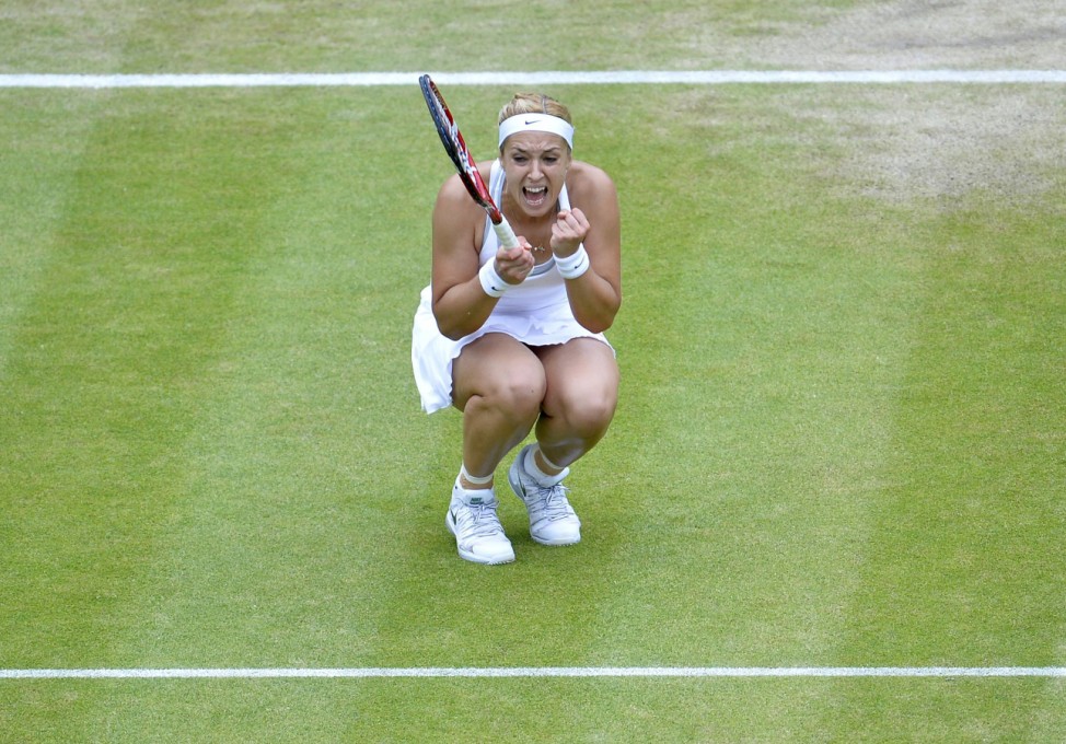 Sabine Lisicki of Germany celebrates after defeating Kaia Kanepi of Estonia in their women's quarter-final tennis match at the Wimbledon Tennis Championships, in London