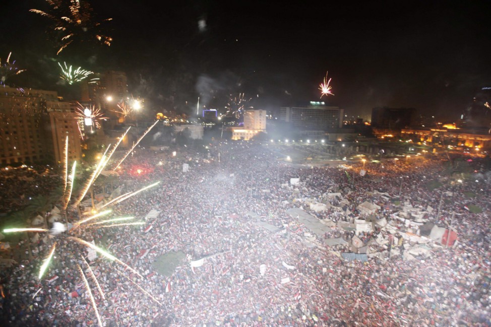 Protesters, who are against Egyptian President Mohamed Mursi, set-off fireworks as they gather in Tahrir Square in Cairo