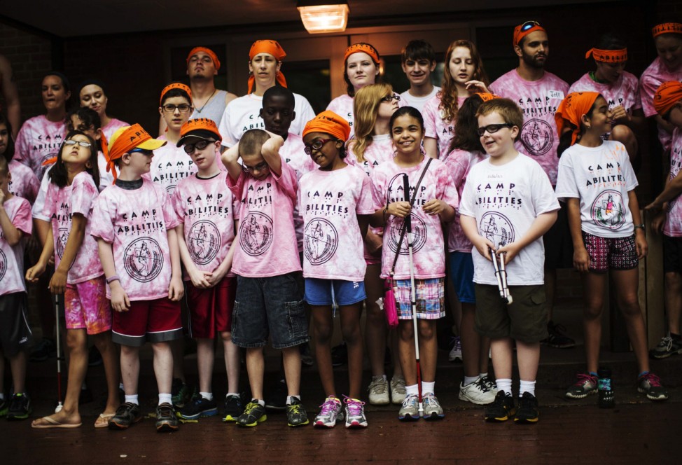 Children pose for their group photograph at Camp Abilities in Brockport