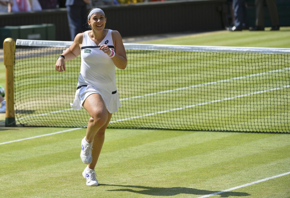 Marion Bartoli of France celebrates after defeating Sabine Lisicki of Germany in their women's singles final tennis match at the Wimbledon Tennis Championships, in London