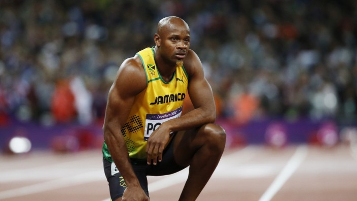 File photo shows Jamaica's Asafa Powell looking at the scoreboard after running in the men's 100m final during the London 2012 Olympic Games