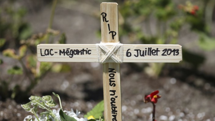 A wooden cross is pictured in front of Sainte-Agnes church in Lac Megantic