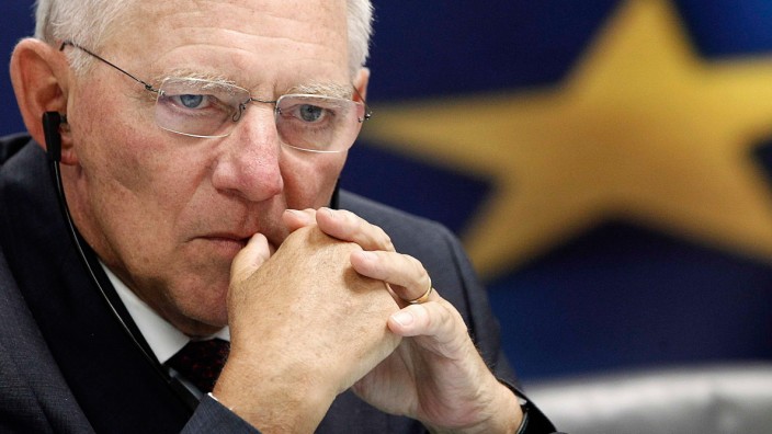 German Finance Minister Schaeuble listens to a news conference in the Greek ministry of finance in Athens