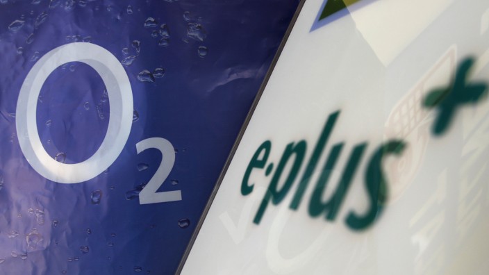 Logo of O2 Deutschland, German daughter of Spain's Telefonica is seen close to E-Plus logo in a store in Germering