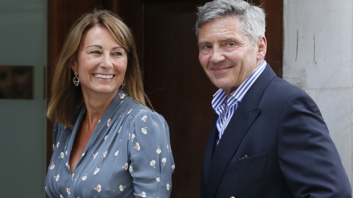 Michael and Carole Middleton arrive at the Lindo Wing of St Mary's Hospital the day after their daughter, Britain's Catherine, Duchess of Cambridge, gave birth to a baby boy, in London