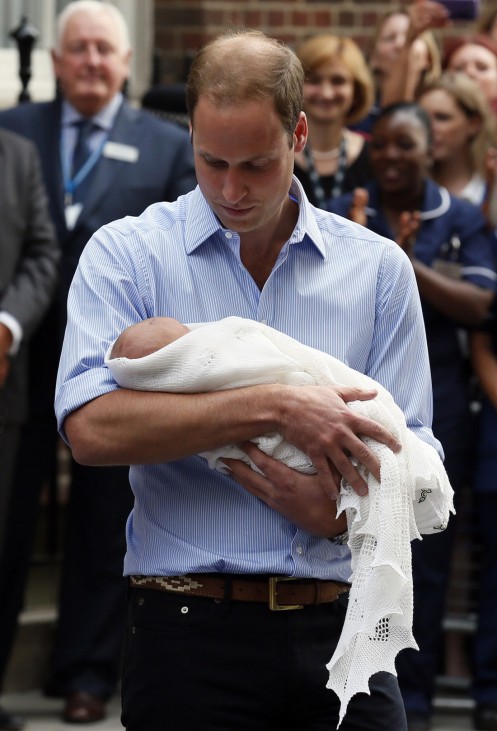 Britain's Prince William and Catherine, Duchess of Cambridge hold their baby boy outside of the Lindo Wing of St Mary's Hospital, in London