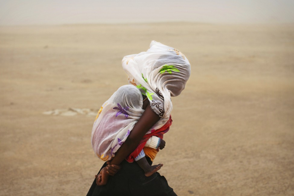 Flucht vor einem Sandsturm in Timbuktu, Mali