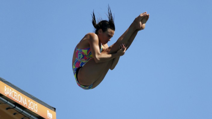 Germany's Bader performs a dive in round 2 of the women's 20m high diving event during the World Swimming Championships at Moll de la Fusta in Barcelona