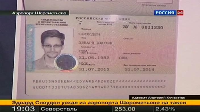 A picture of fugitive former U.S. spy agency contractor Edward Snowden in his new refugee documents granted by Russia in Moscow's Sheremetyevo airport