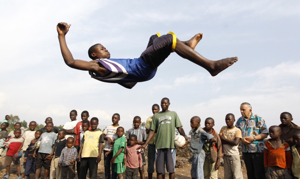A youth jumps through the air as he plays at the Don Bosco Ngangi community center in Goma