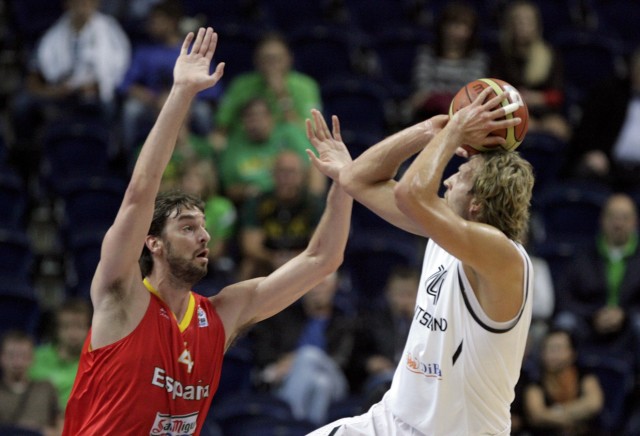 Nowitzki of Germany makes a shot past Pau Gasol of Spain during their FIBA EuroBasket 2011 basketball game in Vilnius