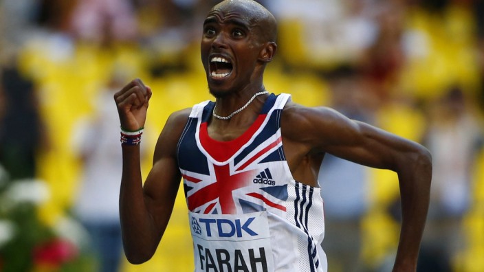 Mo Farah of Britain celebrates winning the men's 10,000 metres final during the IAAF World Athletics Championships in Moscow