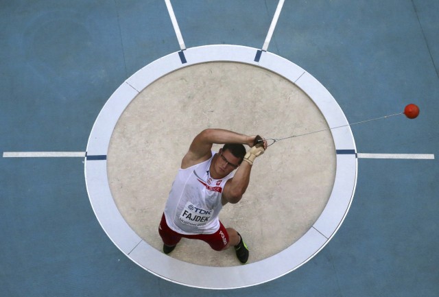 Fajdek of Poland competes in the men's hammer throw qualifying round during the IAAF World Athletics Championships at the Luzhniki stadium in Moscow