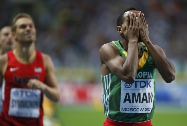 Aman of Ethiopia celebrates his victory next to second placed Symmonds of the U.S. after the men's 800 metres final of the IAAF World Athletics Championships at the Luzhniki Stadium in Moscow