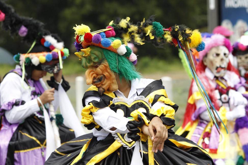 Students wear in traditional costumes during the 494th anniversary parade of Panama Viejo