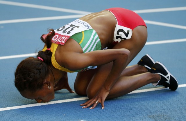 Defar of Ethiopia kisses the track after winning women's 5,000 metres final during the IAAF World Athletics Championships in Moscow