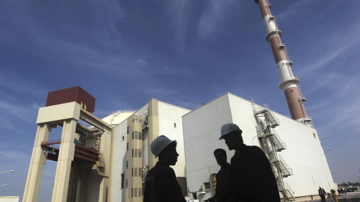 File photo of Iranian workers standing in front of the Bushehr nuclear power plant, about 1,200 km (746 miles) south of Tehran