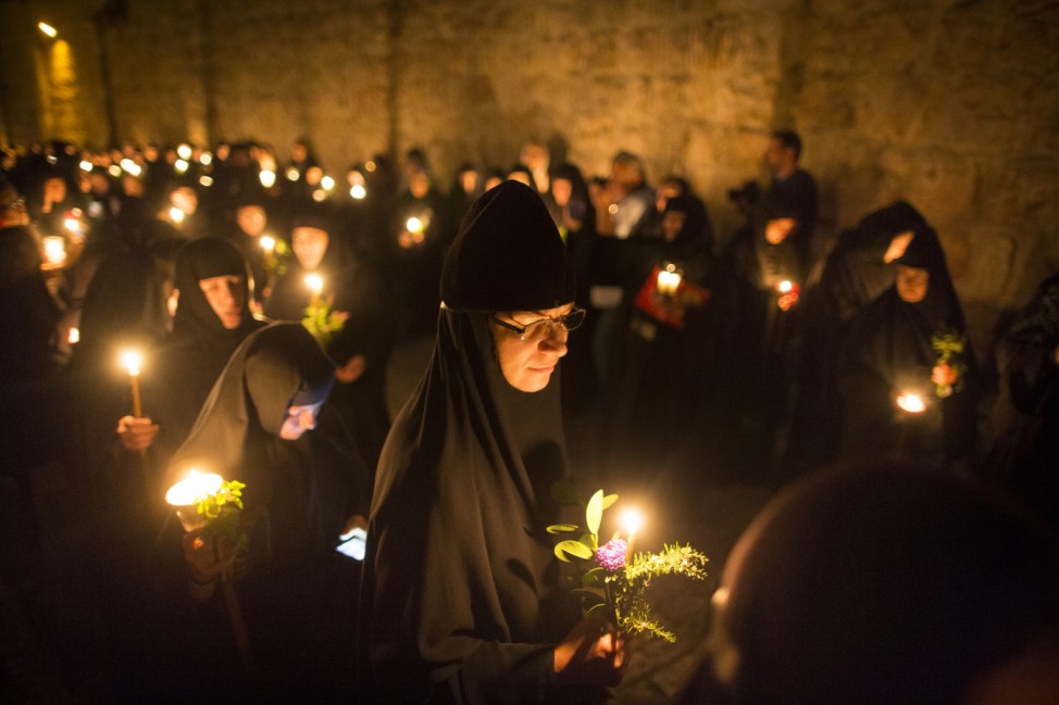 Orthodox Christians Walk In Procession Along The Via Dolorosa