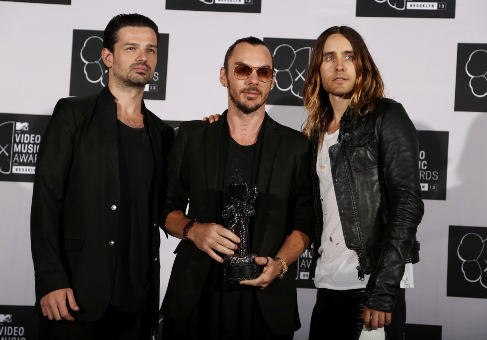 The group Thirty Seconds To Mars 'Up In The Air' stand with their award for best rock video during the 2013 MTV Video Music Awards in New York