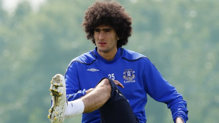 Everton's Fellaini stretches during a training session at their Finch Farm training complex in Liverpool