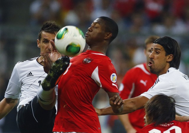 Germany's Klose and Kedhira challenge Austria's Alaba during their World Cup qualifying soccer match in Munich