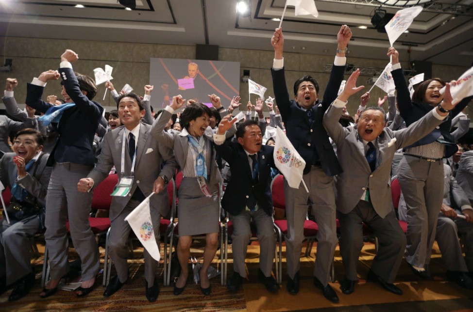 Prime Minister Shinzo Abe of Japan celebrates with members of the Tokyo bid committee as Jacques Rogge President of the International Olympic Committee announces Tokyo as the city to host the 2020 Summer Olympic Game during a ceremony in Buenos Aires