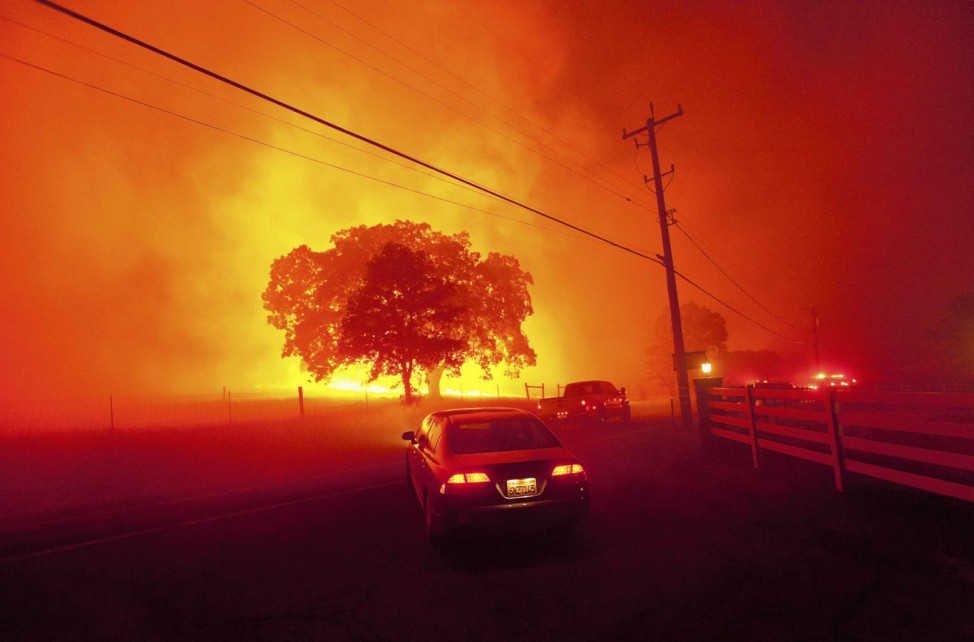 Residents flee as winds whip flames from the Morgan fire along Morgan Territory Road near Clayton, California