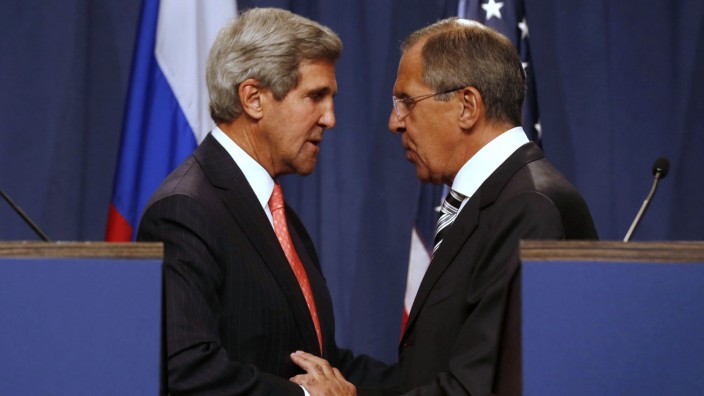 U.S. Secretary of State Kerry and Russian FM Lavrov shake hands after making statements following meetings regarding Syria, at a news conference in Geneva