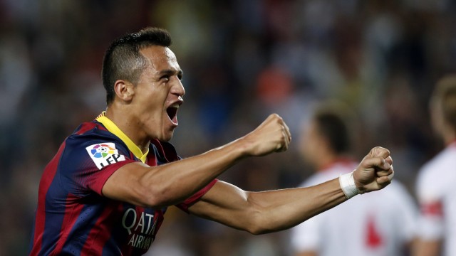 Barcelona's Alexis Sanchez celebrates a goal against Sevilla during their Spanish First division soccer league match at Camp Nou stadium in Barcelona