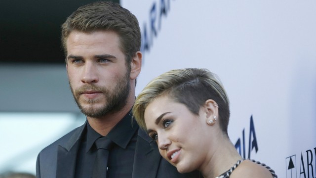 Hemsworth poses with Cyrus at premiere of 'Paranoia' in Los Angeles