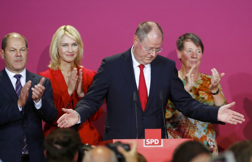 SPD top candidate Steinbrueck acknowledges applause as he speaks after the first exit polls in the German general election (Bundestagswahl) at the party headquarters in Berlin