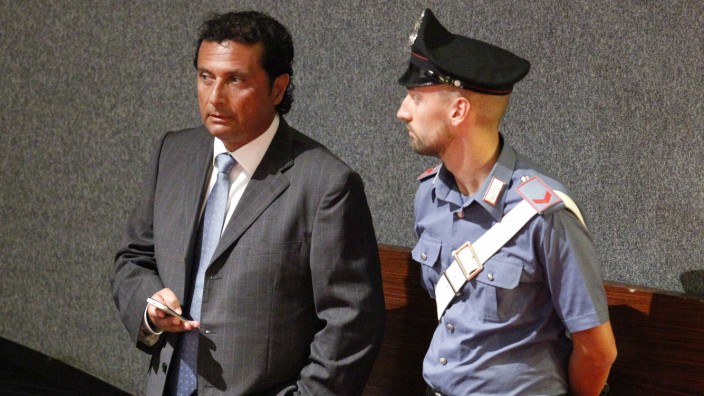 Schettino, captain of the Costa Concordia cruise ship, looks on during a trial in Grosseto