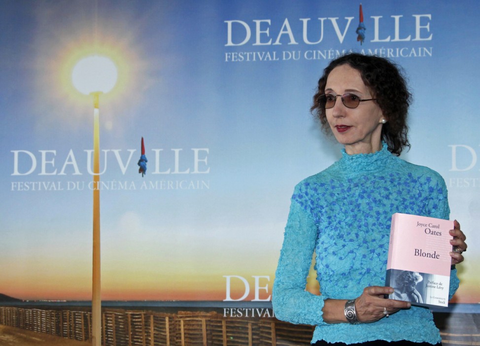 Writer Oates poses with her book 'Blonde' during a photocall after she won the Literary Award at the 36th American film festival in Deauville