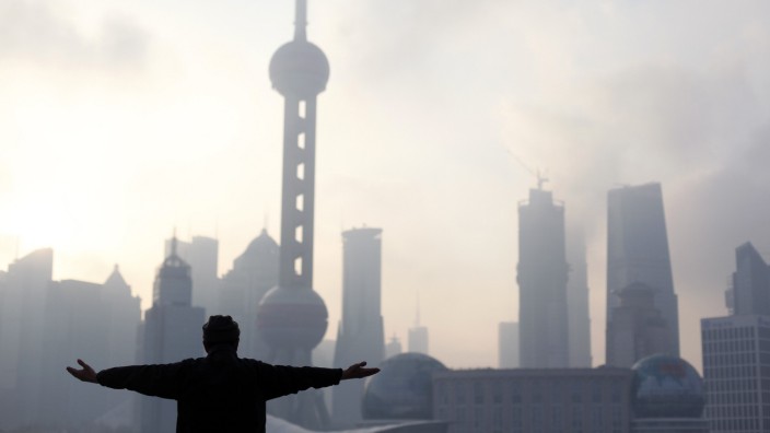 A man practices Tai Chi during an early morning session at the Bund in Shanghai