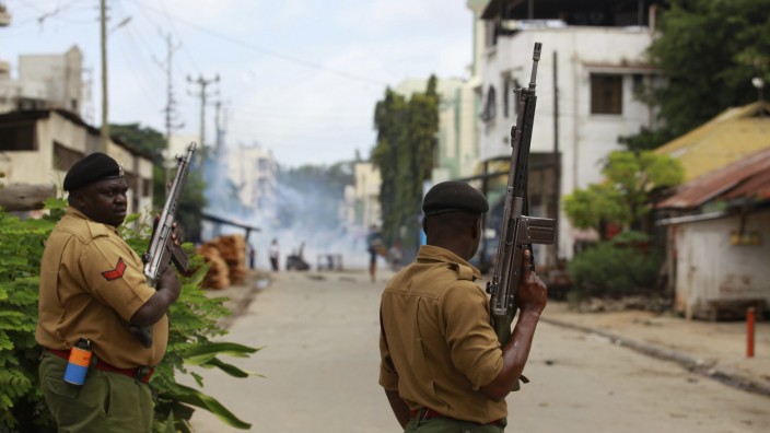 Kenya police attempt to suppress demonstrators reacting to the killing of an Islamic cleric at Kenya's coastal city of Mombasa