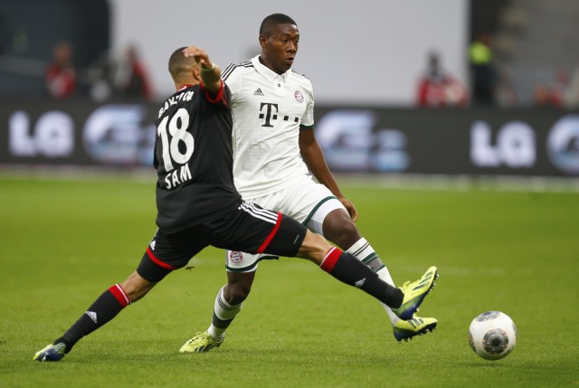 Sam of Bayer Leverkusen challenges Bayern Munich's Alaba during their German first division Bundesliga soccer match in Leverkusen